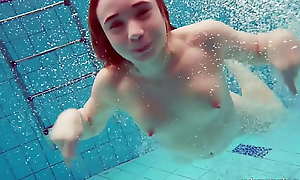 Cute hairy pussy teenie Nina about the swimming pool